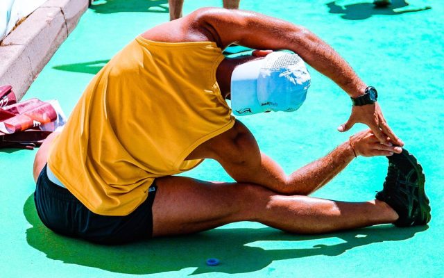 Person stretching to prevent workout injuries