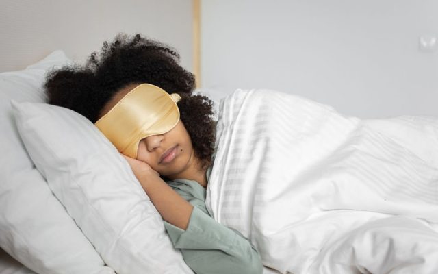 Person sleeping peacefully in bed