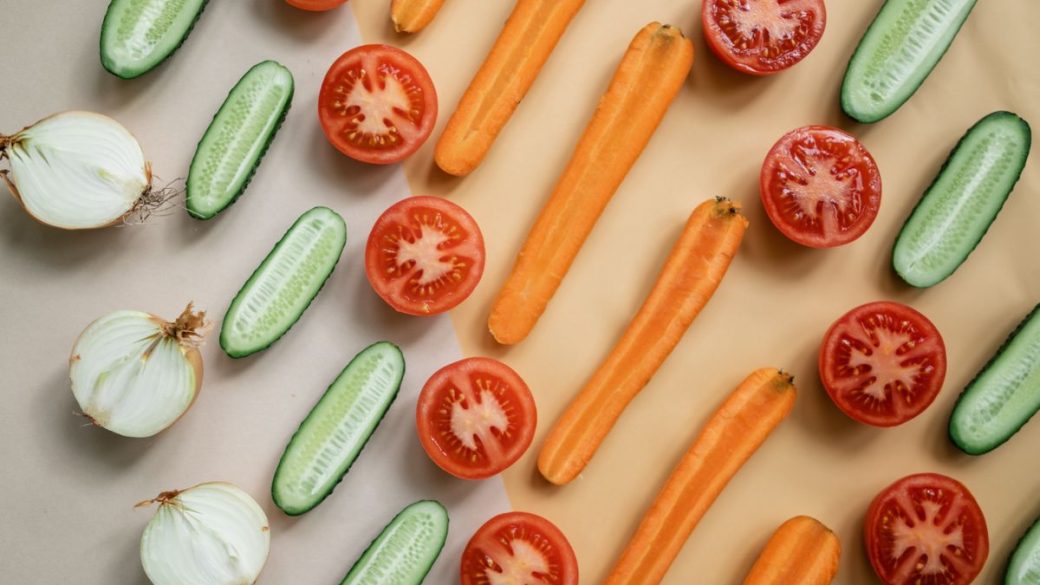 Fresh vegetables and whole foods arranged on a table