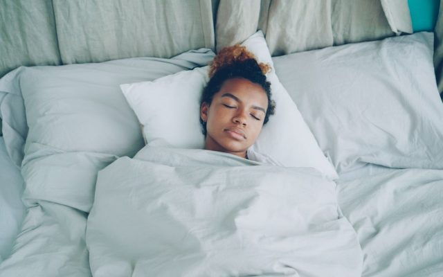 Woman sleeping peacefully in bed during the night