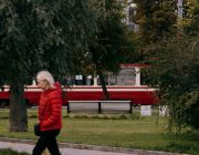 Woman walking outdoors on a park path for fitness