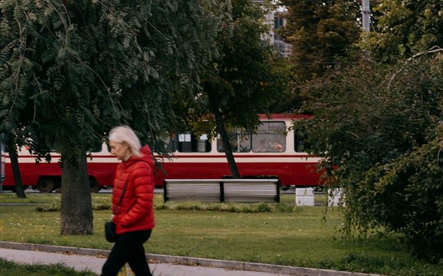 Woman walking outdoors on a park path for fitness