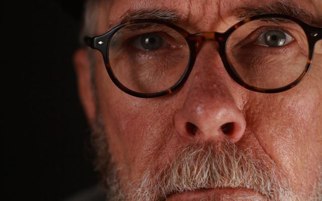Thoughtful middle-aged man looking to the side