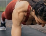 Woman holding a plank position during a core workout