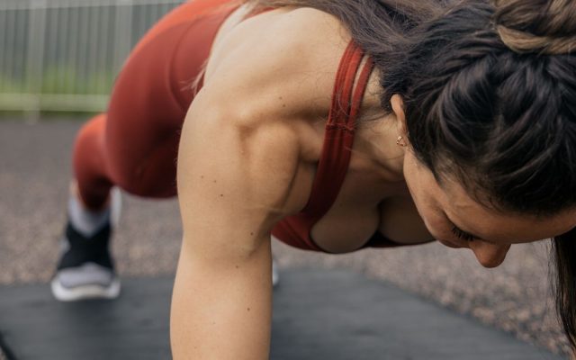 Woman holding a plank position during a core workout
