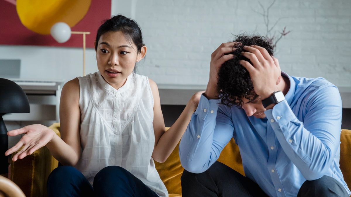 Couple sitting together discussing birth control options and family planning