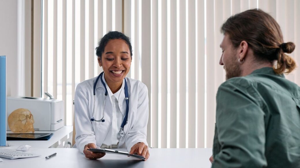 Doctor talking with a patient about birth control options in a bright clinic