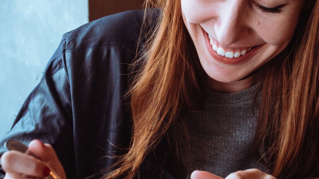 A woman eating a snack, illustrating emotional eating
