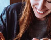A woman eating a snack, illustrating emotional eating