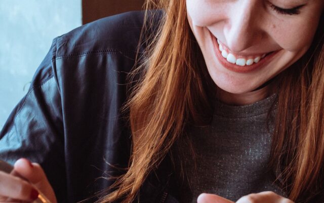 A woman eating a snack, illustrating emotional eating
