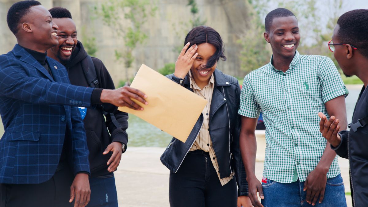 Group of friends laughing together, supportive relationships that build self-esteem