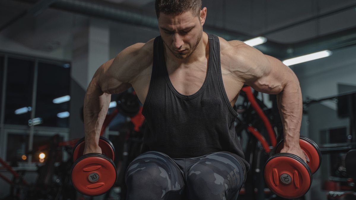 Man strength training with dumbbells for men's health after 50