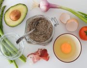 Flat lay of fresh vegetables, avocado and egg for healthy weight loss eating
