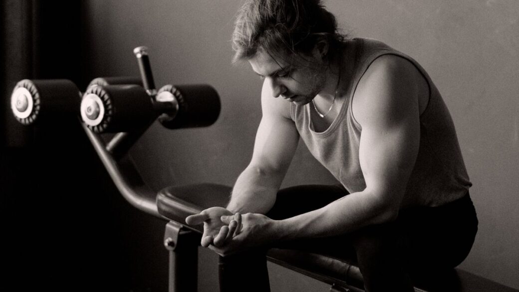Man resting and recovering after a workout on a rest day