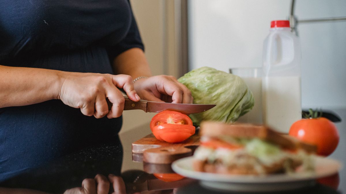 Woman preparing vegetables for an iron-rich meal at home