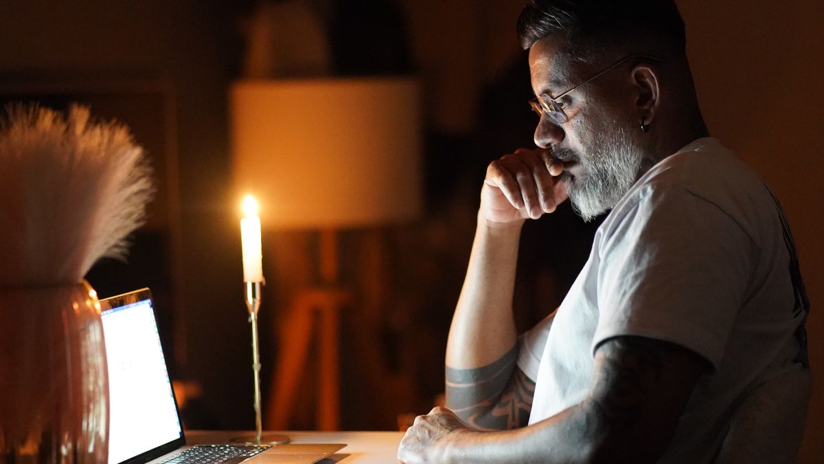 Man working on a laptop late at night, a typical late chronotype pattern