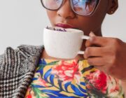 Woman drinking a cup of coffee, thinking about how much caffeine is too much