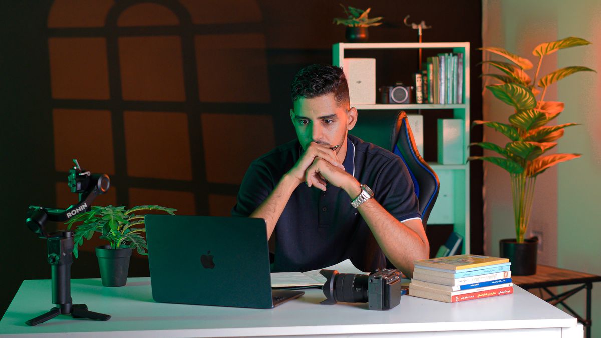 Man focused at his desk after beating procrastination with a small first step