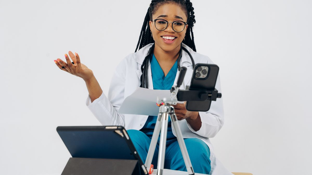 Doctor reviewing a patient medication list during a telehealth consultation